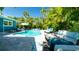 Relaxing backyard featuring a pool, spa, and outdoor seating area at 403 75Th St, Holmes Beach, FL 34217