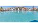 Relaxing community swimming pool on a clear, sunny day reflecting the cabana and lounge chairs at 4304 112Th E St, Palmetto, FL 34221