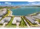 Expansive aerial view of a home and community situated alongside a large lake at 508 Blue Shell Loop, Sarasota, FL 34240