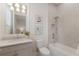 The bathroom includes a shower and bathtub combination and decorative wall art at 508 Blue Shell Loop, Sarasota, FL 34240