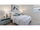 This bedroom features a plush bed, stylish decor, and a bright window at 508 Blue Shell Loop, Sarasota, FL 34240