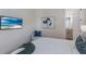 Comfortable bedroom featuring a decorative art and a view to the ensuite bathroom at 508 Blue Shell Loop, Sarasota, FL 34240
