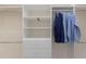 Bright, white walk-in closet with drawers, shelves, and hanging rods ready for organization at 508 Blue Shell Loop, Sarasota, FL 34240