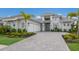 Attractive home featuring a three-car garage, and well-maintained landscaping at 508 Blue Shell Loop, Sarasota, FL 34240