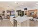 Gourmet kitchen with an island, seamless access to the dining area, and outdoor pool at 508 Blue Shell Loop, Sarasota, FL 34240