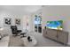 Inviting living room with comfortable seating and access to an outdoor patio view at 508 Blue Shell Loop, Sarasota, FL 34240