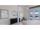 Stylish main bedroom showcases lake views, chic decor, and seamless access to the outdoors at 508 Blue Shell Loop, Sarasota, FL 34240