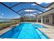 Screened in pool, including a spa, with scenic water views, ideal for relaxation and entertainment at 508 Blue Shell Loop, Sarasota, FL 34240