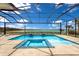 Screened in pool, including a spa, with scenic water views, ideal for relaxation and entertainment at 508 Blue Shell Loop, Sarasota, FL 34240