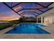 This beautiful pool features a spa, water features, and a screened enclosure with sunset views at 508 Blue Shell Loop, Sarasota, FL 34240