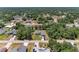 Residential aerial showcasing neighborhood with mature trees and well-maintained homes in a Gathering-friendly community at 5168 Cillette Ave, North Port, FL 34288
