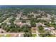 Aerial view of a neighborhood featuring well-maintained homes and lush green trees at 5168 Cillette Ave, North Port, FL 34288