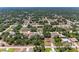 Aerial view of a neighborhood featuring well-maintained homes and lush green trees at 5168 Cillette Ave, North Port, FL 34288