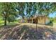 Expansive backyard with mature trees and screened in patio providing a relaxing outdoor space at 5168 Cillette Ave, North Port, FL 34288
