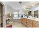 Bathroom features a walk-in shower, soaking tub, and dual sink vanity at 5168 Cillette Ave, North Port, FL 34288