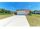 Charming single-story home with a spacious driveway and a two-car garage in a quiet neighborhood at 5168 Cillette Ave, North Port, FL 34288