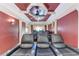 Private home theater with comfortable seating, dramatic lighting, and a built-in sound system for movie nights at 5168 Cillette Ave, North Port, FL 34288