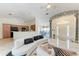 Open-concept living area with elegant marble floors, stylish seating, and access to the kitchen at 5168 Cillette Ave, North Port, FL 34288