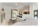 Spacious living room featuring marble floors, modern furniture, and an open layout to the kitchen at 5168 Cillette Ave, North Port, FL 34288