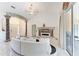 Bright living room with elegant columns, fireplace, access to the front door, and sliding glass doors at 5168 Cillette Ave, North Port, FL 34288