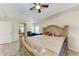 This large main bedroom features a tray ceiling, ceiling fan, and large bed at 5168 Cillette Ave, North Port, FL 34288