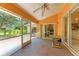 Relaxing screened-in patio with ceiling fan, ready for outdoor entertaining and enjoying the view at 5168 Cillette Ave, North Port, FL 34288