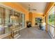 Enclosed patio with ceiling fan and exercise equipment at 5168 Cillette Ave, North Port, FL 34288