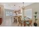 Dining area features a glass table, seating for four, decorative lighting and large window at 5238 Aqua Breeze Dr, Bradenton, FL 34208