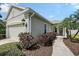 Beautiful home exterior featuring manicured landscaping, a well-lit walkway, and a two-car garage on a sunny day at 5238 Aqua Breeze Dr, Bradenton, FL 34208