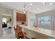 Open kitchen with counter seating and view of the bedroom at 5238 Aqua Breeze Dr, Bradenton, FL 34208