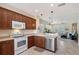 Open kitchen with stainless steel appliances and view of the living space at 5238 Aqua Breeze Dr, Bradenton, FL 34208