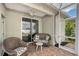 Screened patio area featuring brick flooring and comfortable seating with sliding glass door access to interior at 5238 Aqua Breeze Dr, Bradenton, FL 34208
