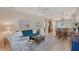 Cozy living room with neutral tones and a stylish dining area with bar seating at 5238 Aqua Breeze Dr, Bradenton, FL 34208