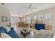 Inviting living room with tile flooring, ceiling fan, comfortable furniture and decor at 5238 Aqua Breeze Dr, Bradenton, FL 34208