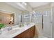 Bright main bathroom with double sinks and glass enclosed shower at 5238 Aqua Breeze Dr, Bradenton, FL 34208