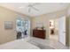 Main bedroom featuring tile floors, sliding glass doors, and access to the lanai at 5238 Aqua Breeze Dr, Bradenton, FL 34208