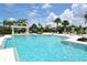 Inviting community pool featuring turquoise water, lounge chairs, and shaded pergola for relaxation at 5238 Aqua Breeze Dr, Bradenton, FL 34208