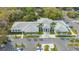 A beautiful community building with a gray roof surrounded by green trees and well-maintained landscaping at 5269 Wedgewood Ln # 36, Sarasota, FL 34235