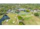 Beautiful aerial view of the golf course, clubhouse, and surrounding nature at The Meadows Country Club at 5269 Wedgewood Ln # 36, Sarasota, FL 34235