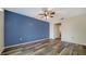 Bedroom features natural light, wood-look flooring, and spacious layout at 5269 Wedgewood Ln # 36, Sarasota, FL 34235