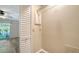 Neutral toned closet with shelving, and white bi-fold door at 5269 Wedgewood Ln # 36, Sarasota, FL 34235