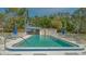 Enjoy this sparkling clean community pool complete with lounge chairs and shade at 5269 Wedgewood Ln # 36, Sarasota, FL 34235