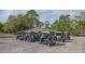 Golf carts parked at a golf course with tropical landscaping at 5269 Wedgewood Ln # 36, Sarasota, FL 34235