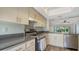 Modern kitchen with stainless steel appliances, contemporary cabinetry and updated countertops at 5269 Wedgewood Ln # 36, Sarasota, FL 34235