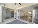 Seamless transition from the screened lanai to the spacious living area through sliding doors at 5269 Wedgewood Ln # 36, Sarasota, FL 34235