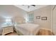 Cozy bedroom with white furniture, a window, and wood floors at 5283 Descanso Ct # 101B18, Sarasota, FL 34238