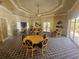 Spacious community room with round tables, chairs, and a large TV for social events and entertainment at 5283 Descanso Ct # 101B18, Sarasota, FL 34238