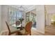 Charming dining area with natural light, round glass table, and comfortable seating at 5283 Descanso Ct # 101B18, Sarasota, FL 34238
