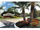 A well-maintained community entrance sign surrounded by lush landscaping at 5283 Descanso Ct # 101B18, Sarasota, FL 34238