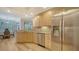 Bright kitchen features stainless appliances, light cabinetry, and bar seating at 5283 Descanso Ct # 101B18, Sarasota, FL 34238